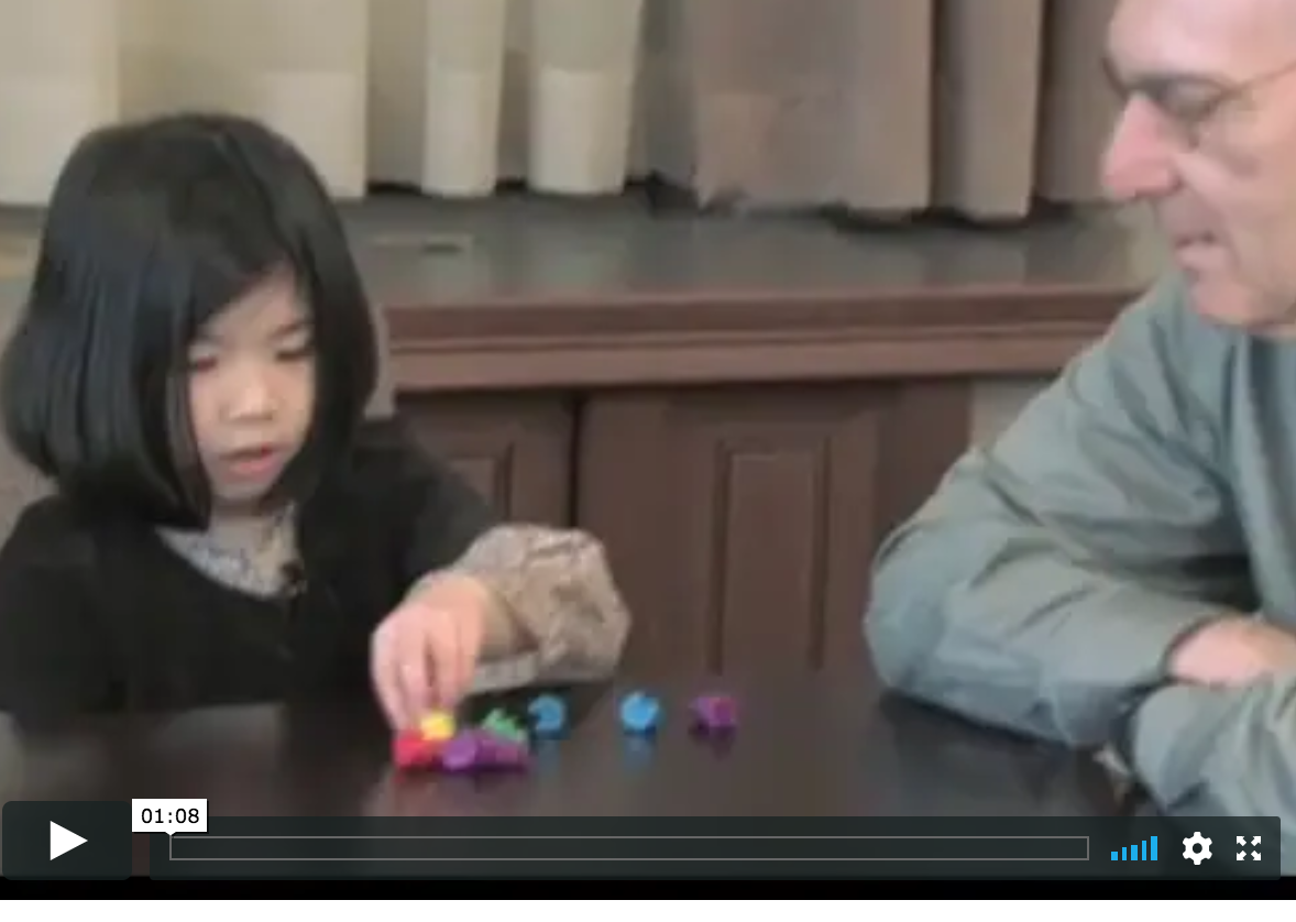 screenshot of video with young child and Herb Ginsburg