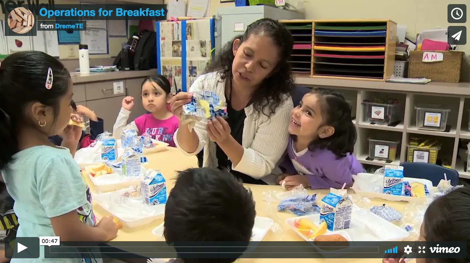 screenshot of video with Ms. Torres and her preschool students at breakfast table