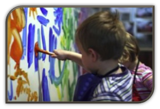 preschool child painting on board