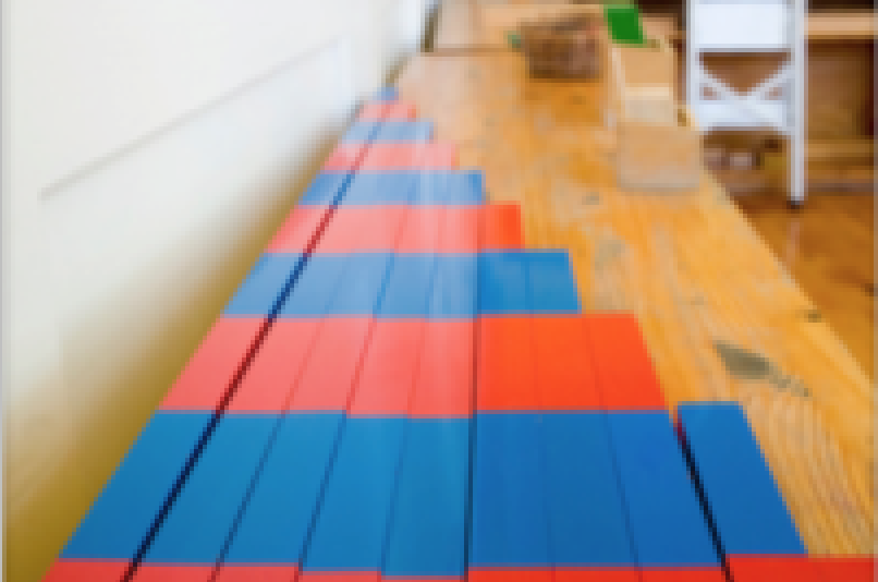 red and blue wooden blocks in a growing pattern