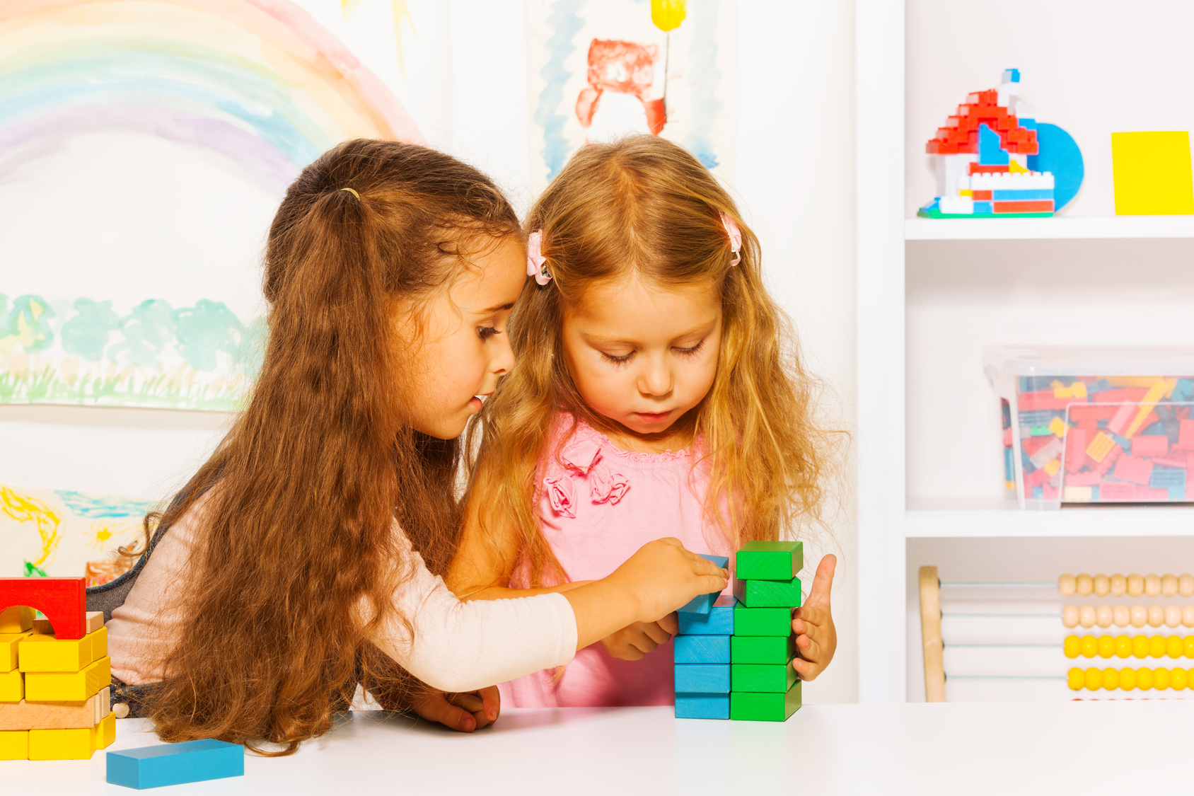 two children stacking blocks